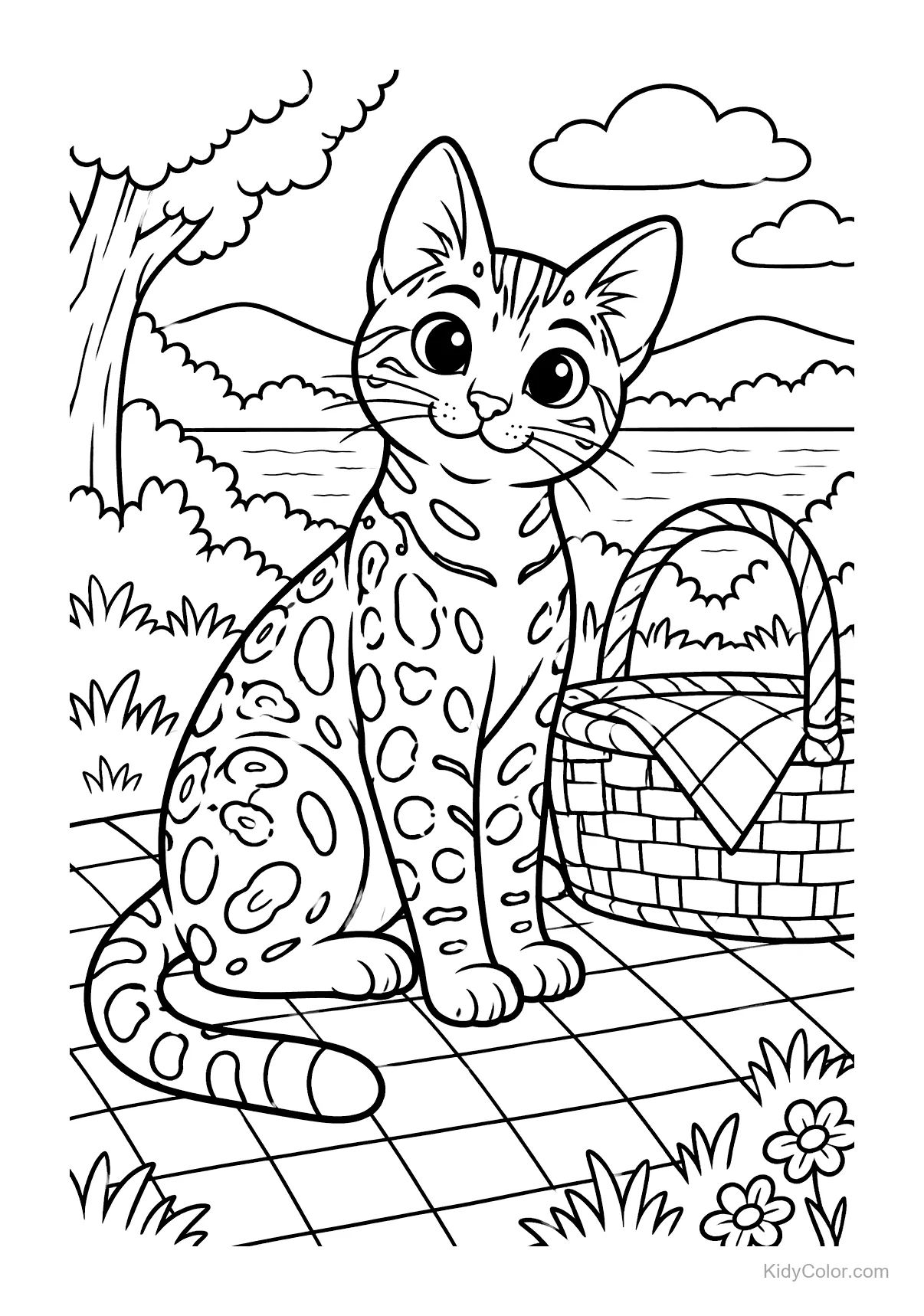 Gatto Bengalese seduto vicino a un cestino da picnic al lago.